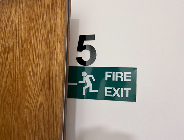 Photo of a fire exit sign in a building