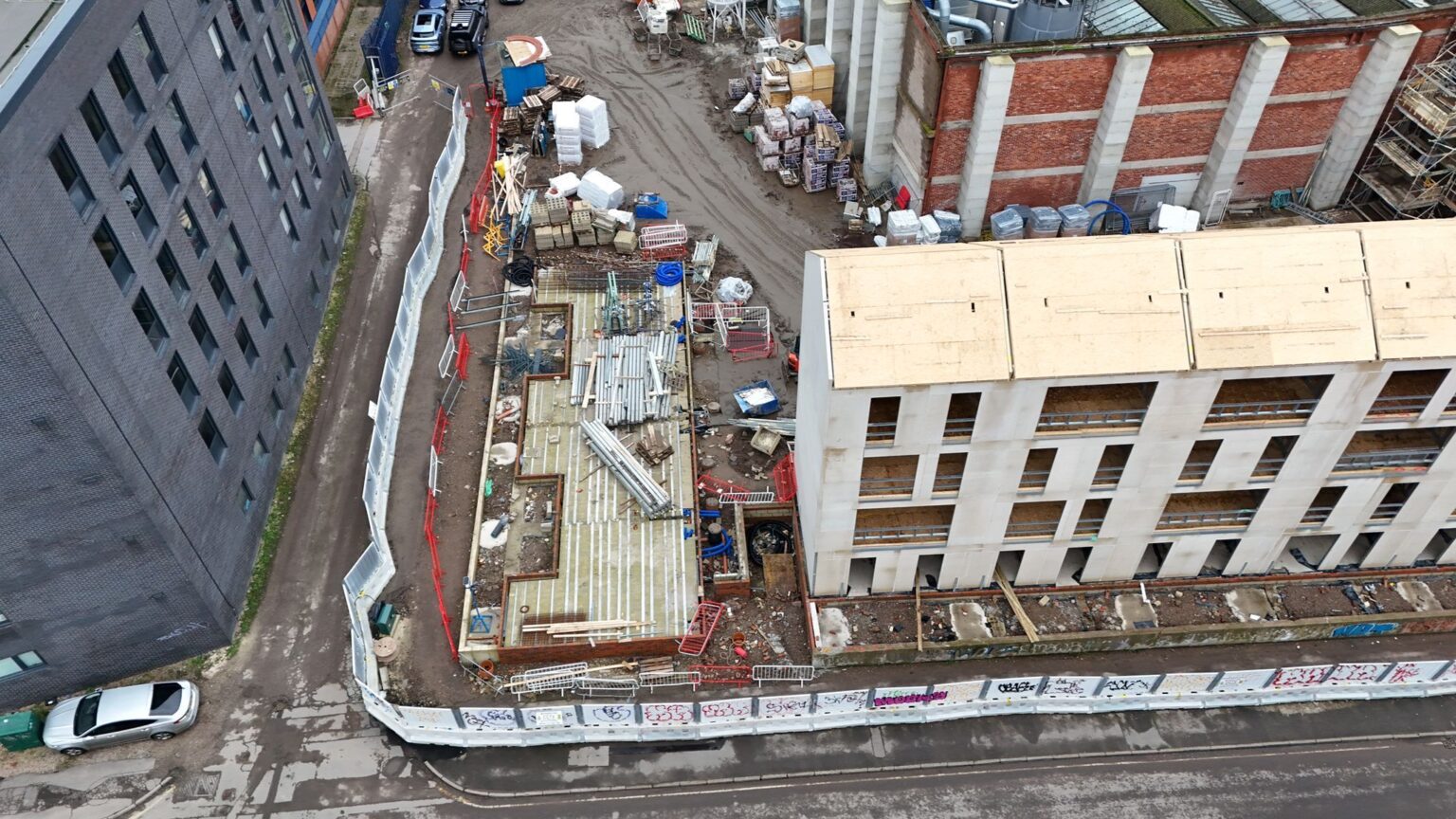 ariel shot of a building site, taken by a drone as part of project monitoring services.