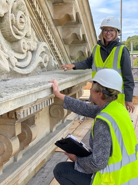 Two heritage surveyors surveying a heritage project. 